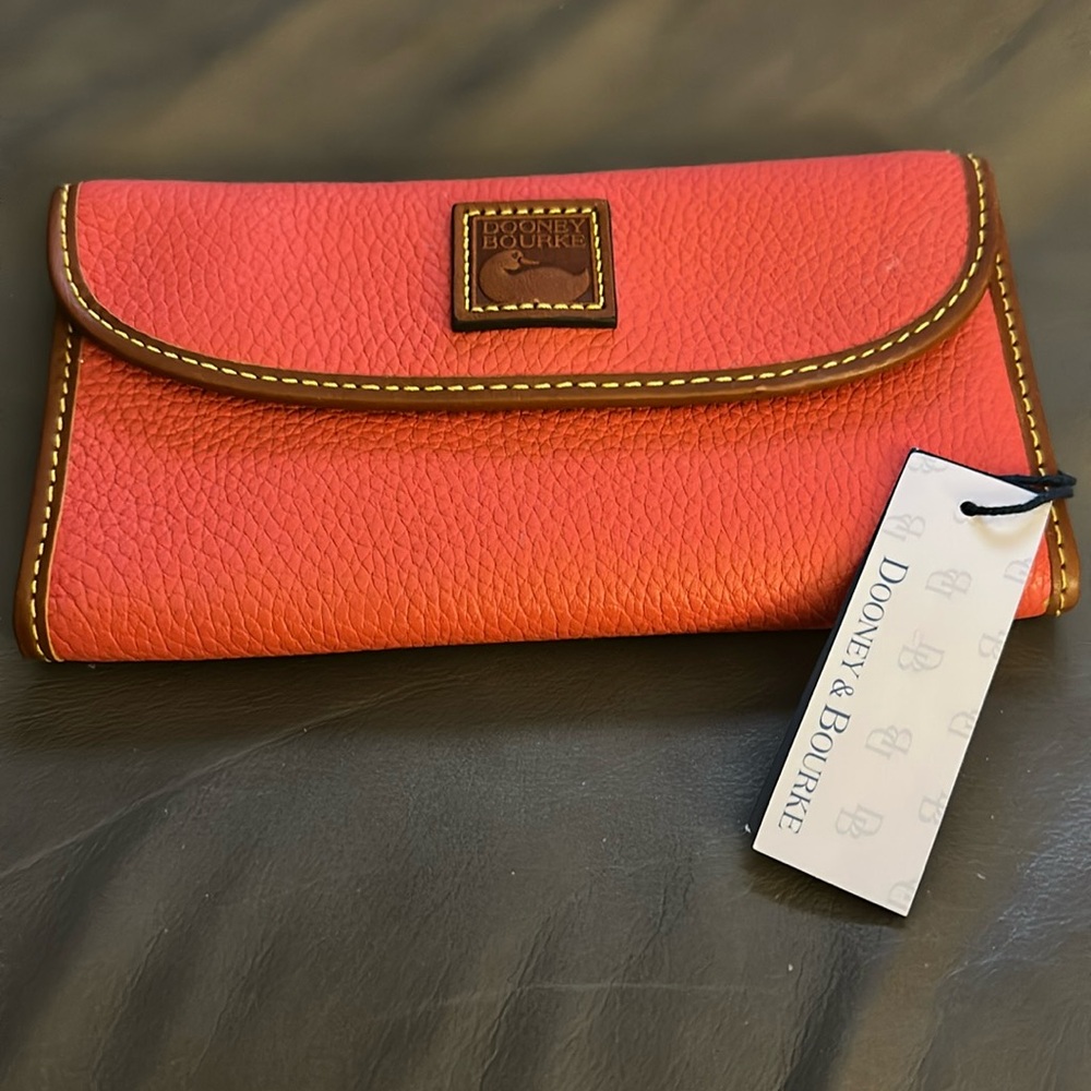 Gorgeous Dooney wallet coral red with brown stitching